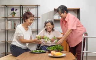 Family preparing food together with an elderly dementia patient.